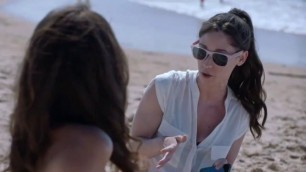 Latina taking Topless Pictures of her Friend at the Beach